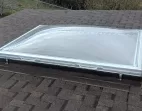 Removable Skylight with Clear Acrylic Domes on a Sloped Shingle Roof