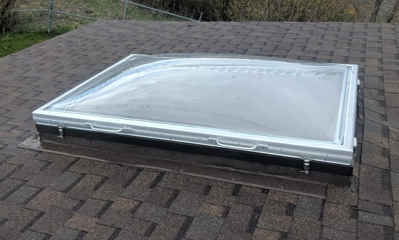 Removable Skylight with Clear Acrylic Domes on a Sloped Shingle Roof