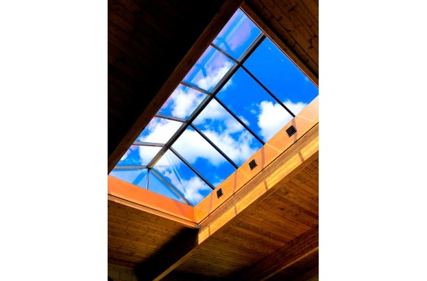 New Installed glass pyramid skylight over wood cladded pool area