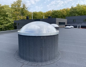 curb mounted circular skylight.