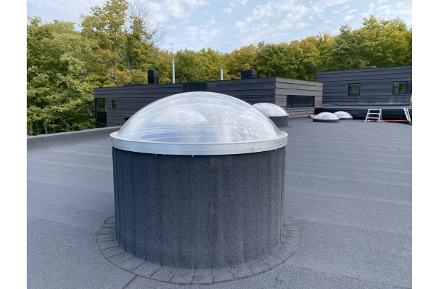 curb mounted circular skylight.