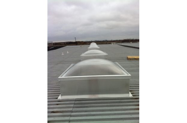 Clear Acrylic Dome Skylight with Frost Free Frames on an Aluminum Curb