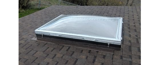 Removable Skylight with Clear Acrylic Domes on a Sloped Shingle Roof