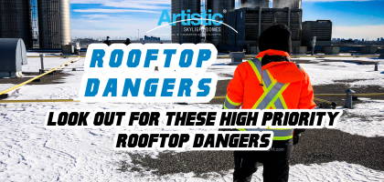 worker standing on a roof in front of a skylight