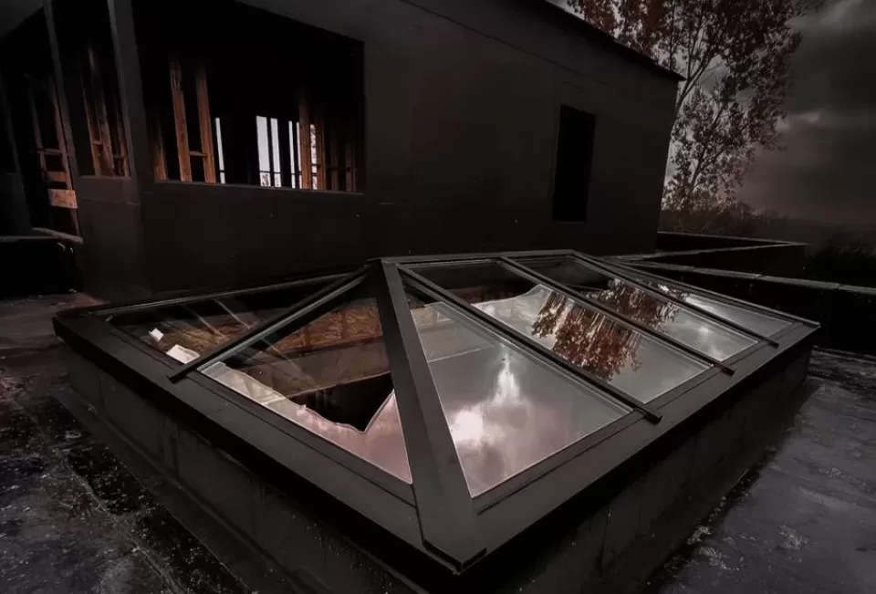 Glass pyramid skylight for a low profile application installed new